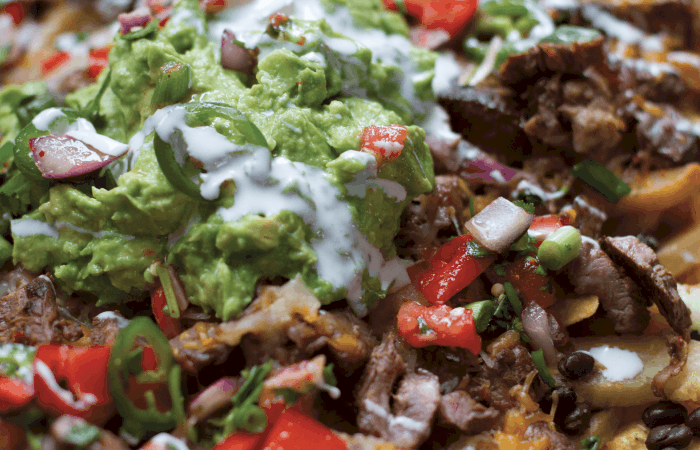 Close up of Loaded Monster Carne Asada Nachos