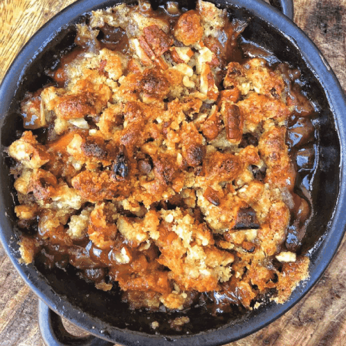 Aerial view of Candied Yam Casserole with Brown Sugar Streusel in a cast iron skillet