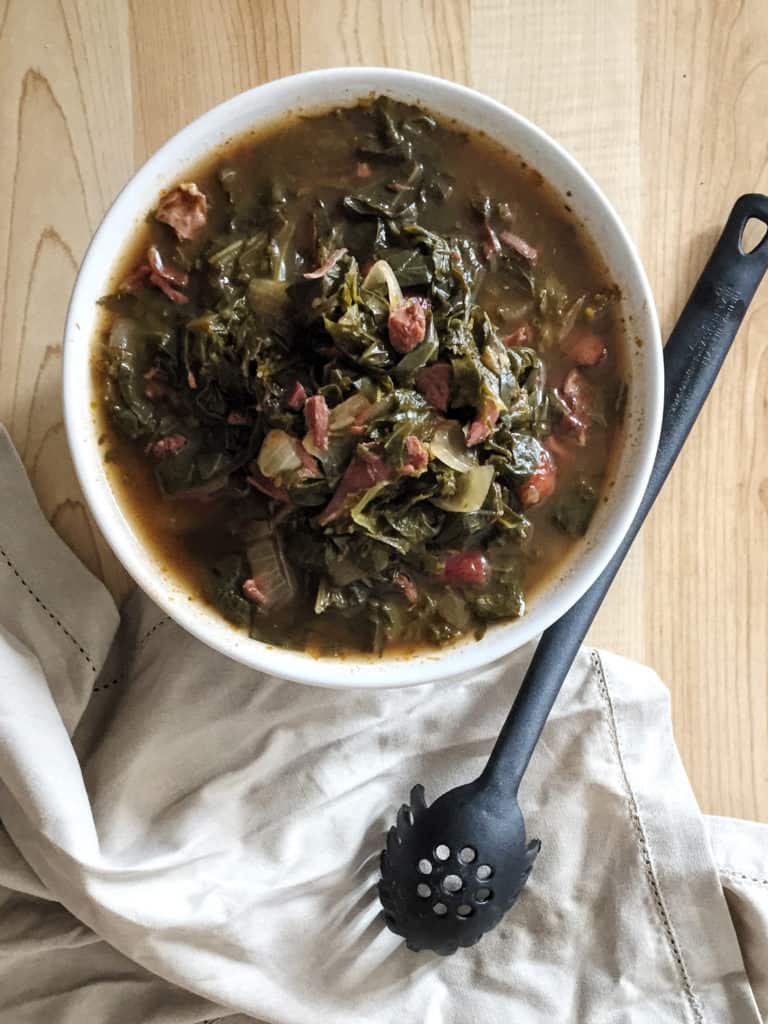 bowl of southern style greens with a spoon