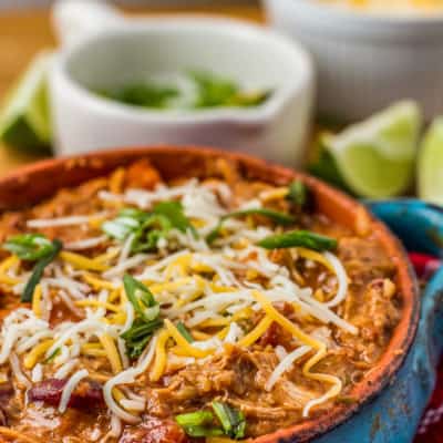 bowl of pulled chicken chili topped with cheese