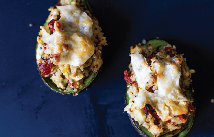 Italian Sausage & Quinoa Stuffed Avocados - these tasty avocados are packed with Italian chicken sausage, quinoa, roasted red bell peppers and parmesan cheese.