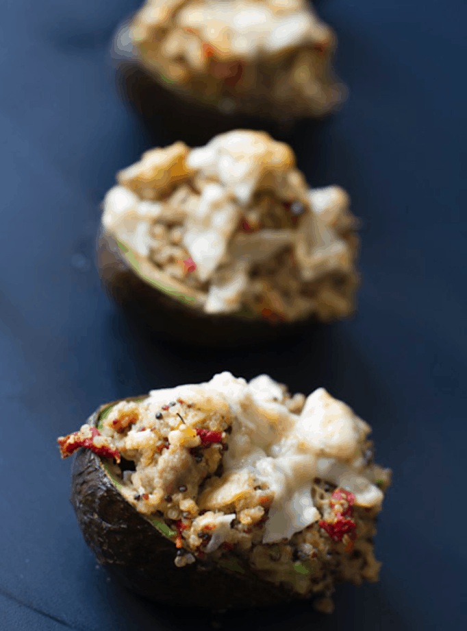 Italian Sausage & Quinoa Stuffed Avocados - these tasty avocados are packed with Italian chicken sausage, quinoa, roasted red bell peppers and parmesan cheese.