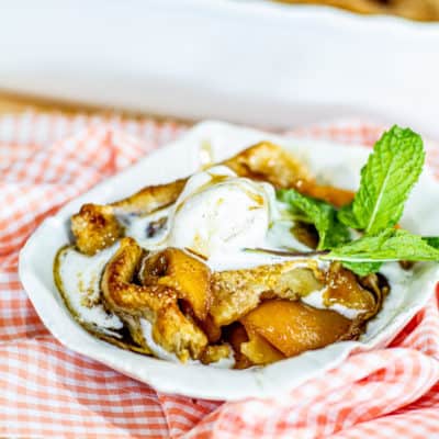 Peach Cobbler with ice cream on plate