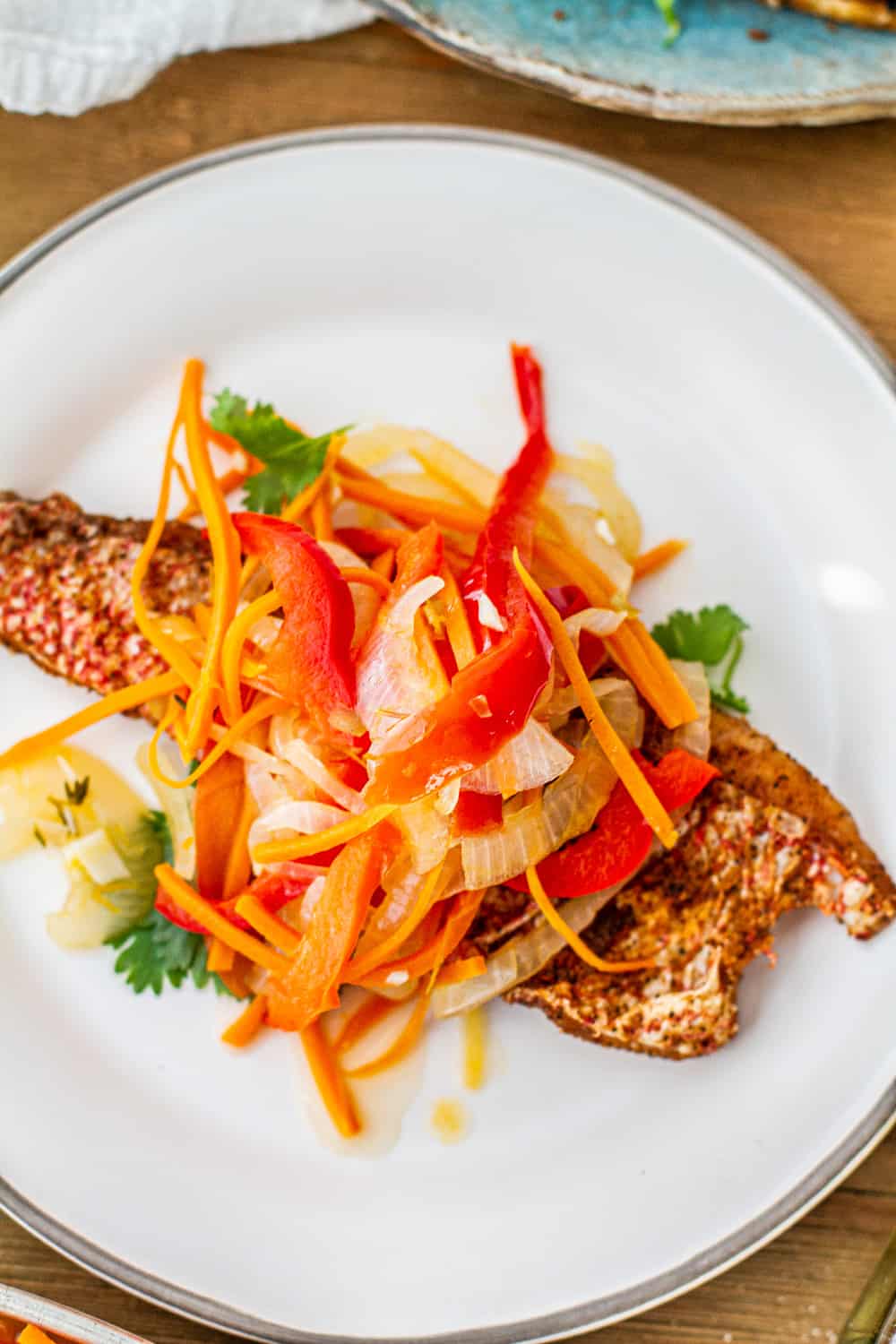 Overhead shot Escovitched Fish on white plate