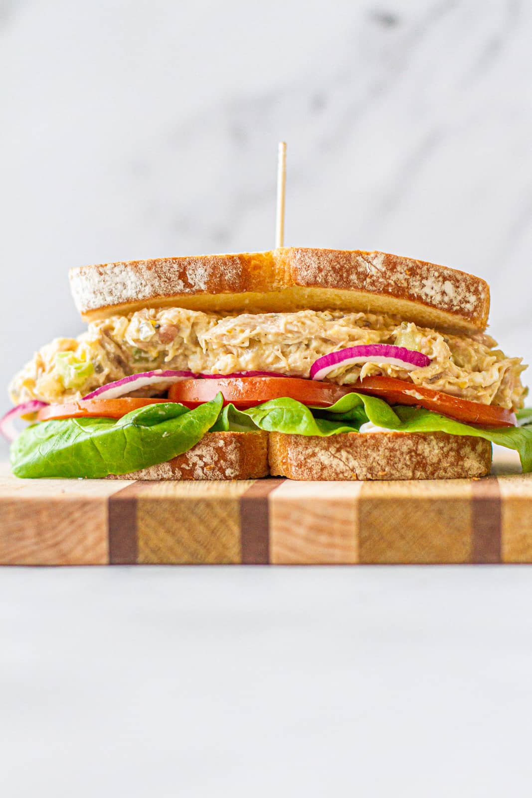 heroic shot of chicken salad sandwich