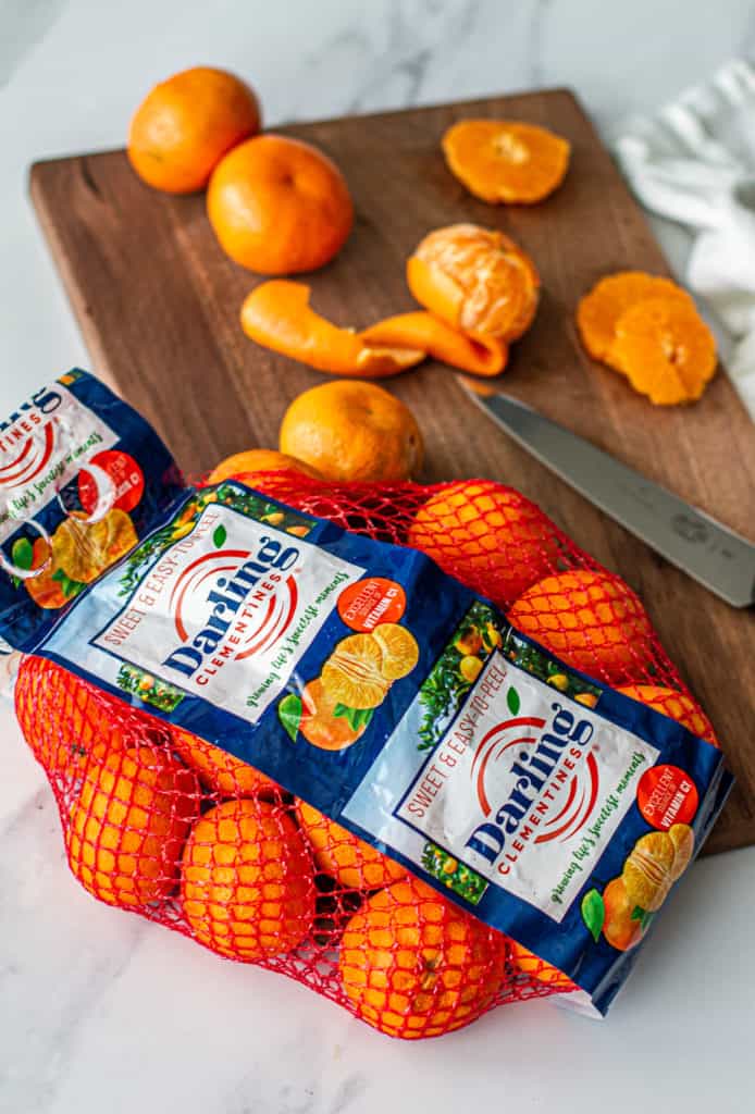 bag of darling clementines on wooden cutting board for detox glow bowl