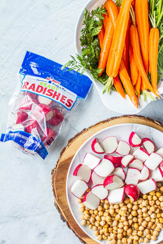 Recipe ingredients on table - radishes, carrots, chickpeas