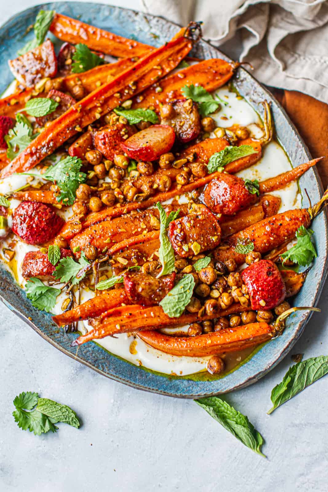 Platter with moroccan-spiced carrot & radish salad over a napkin