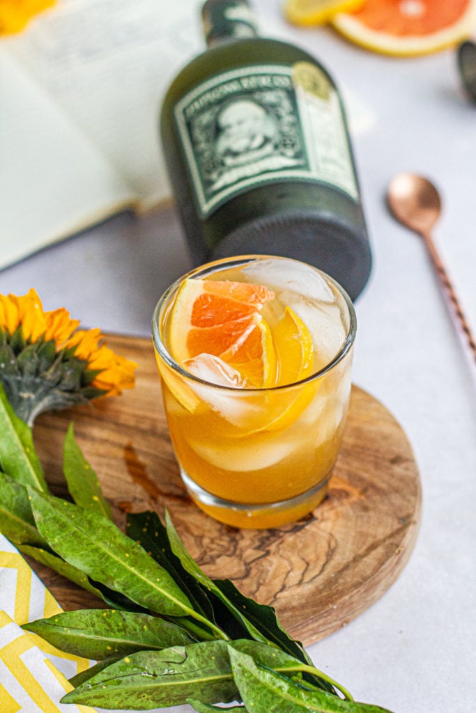 summer citrus rum punch with bottle of diplomatico rum