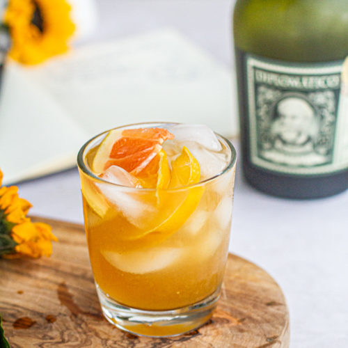 summer citrus rum punch with bottle of diplomatico rum
