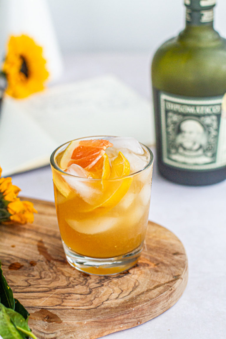 summer citrus rum punch with bottle of diplomatico rum