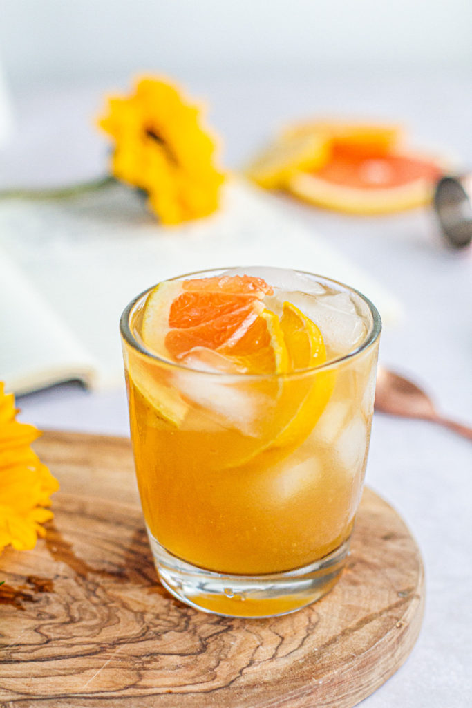 summer citrus rum punch with slices of grapefuite, lemon and orange