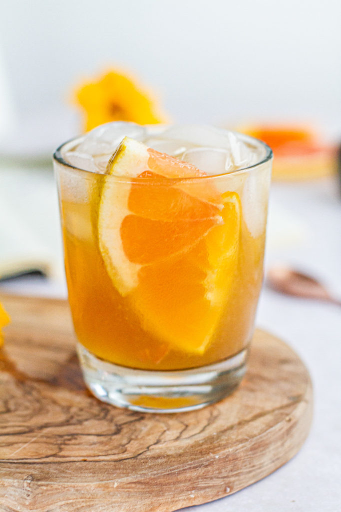 summer citrus rum punch with slices of grapefuite, lemon and orange