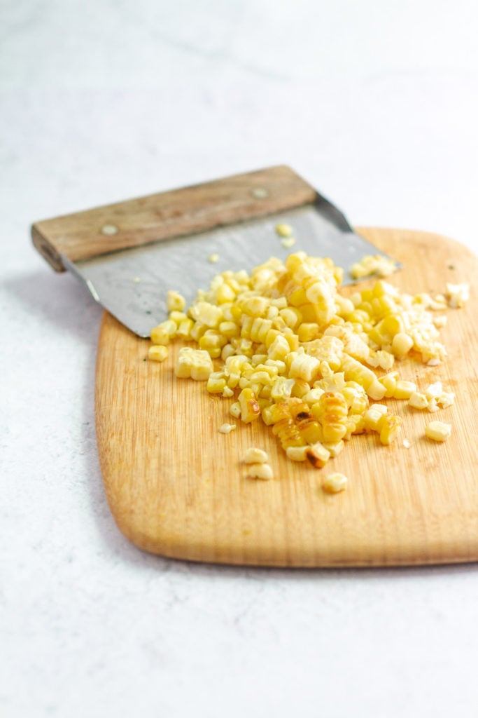 Corn kernels for corn salsa on cutting board