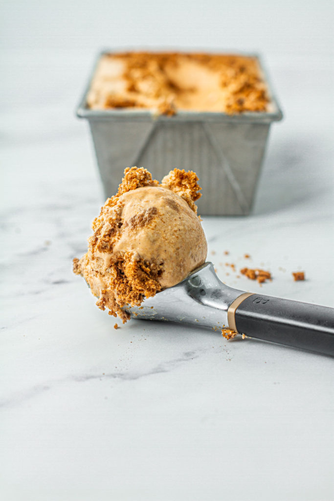 scoop of ice cream with chunks of biscoff cookies