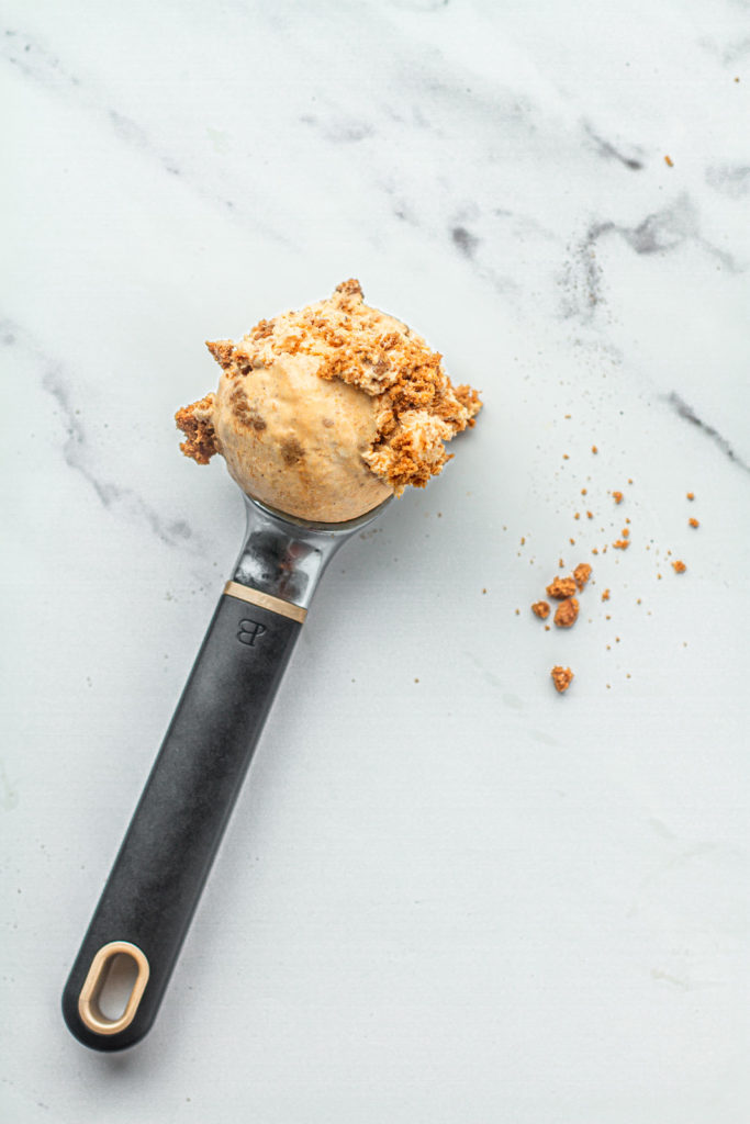 scoop pumpkin spice ice cream with chunks of biscoff cookies