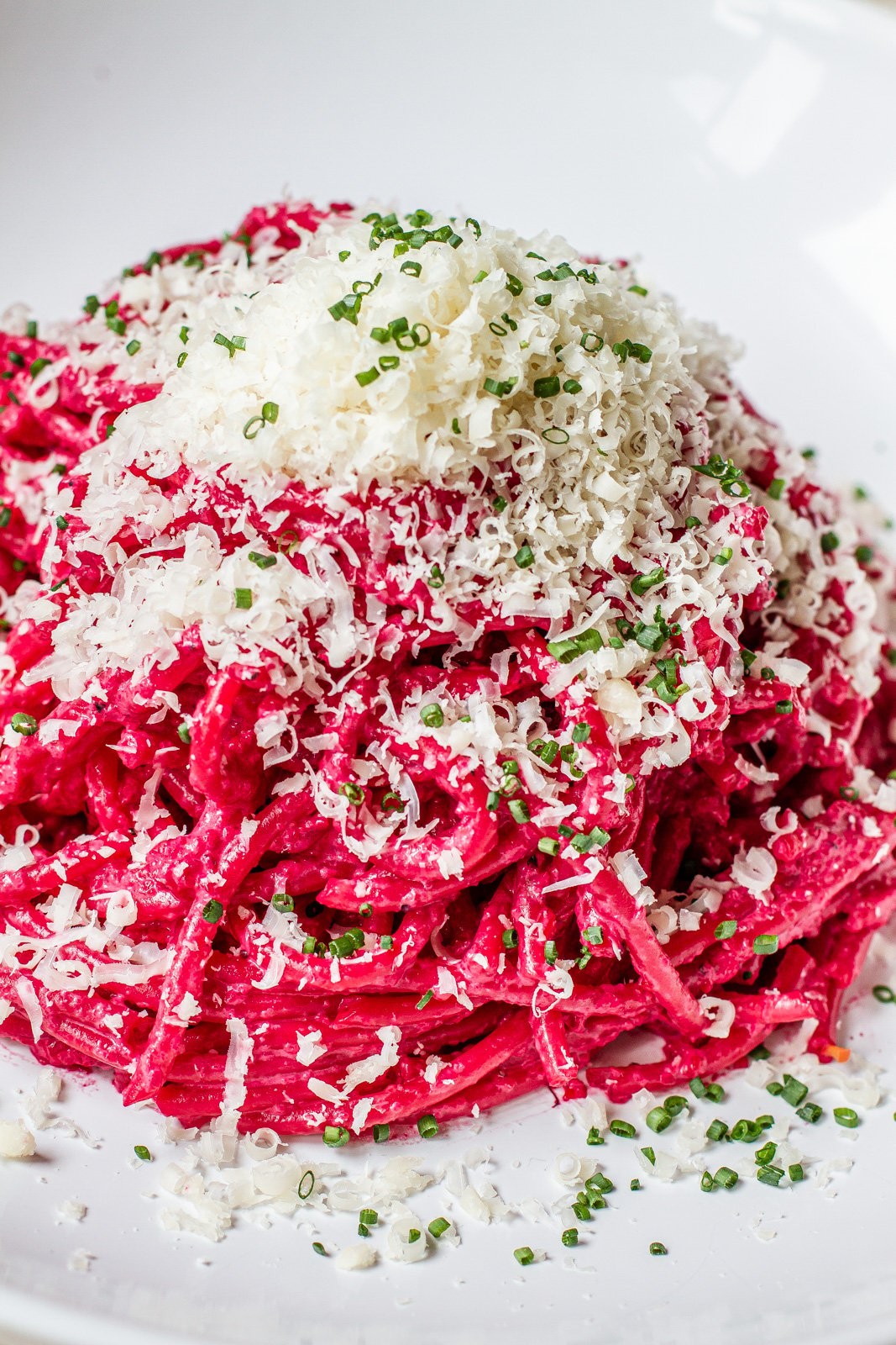 pink spaghetti with parmesan cheese