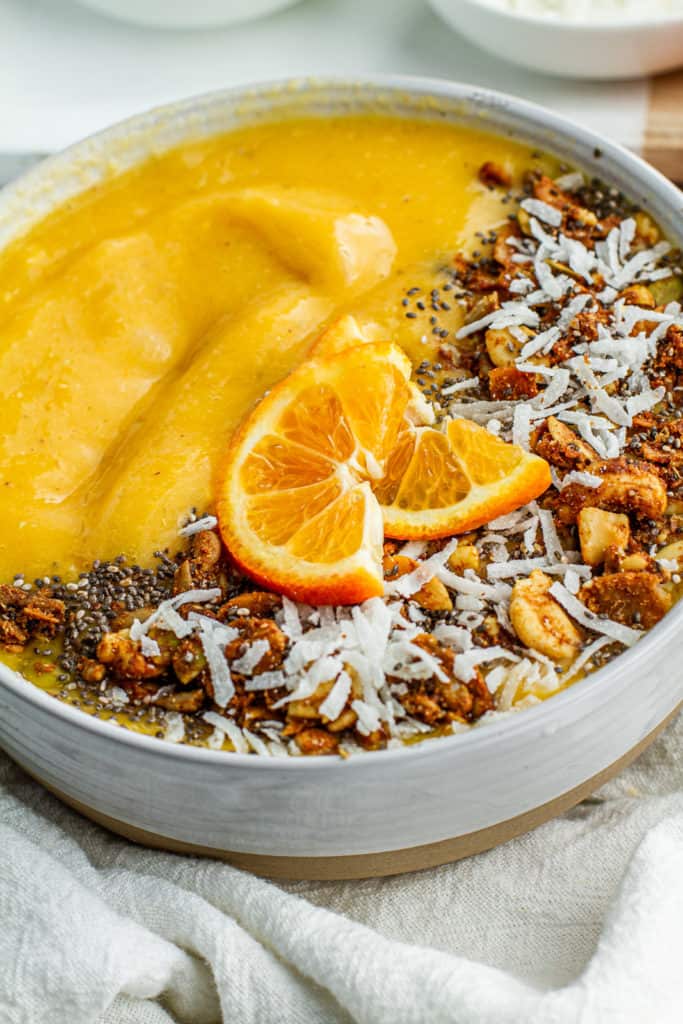 close up of clementine sunshine smoothie bowl