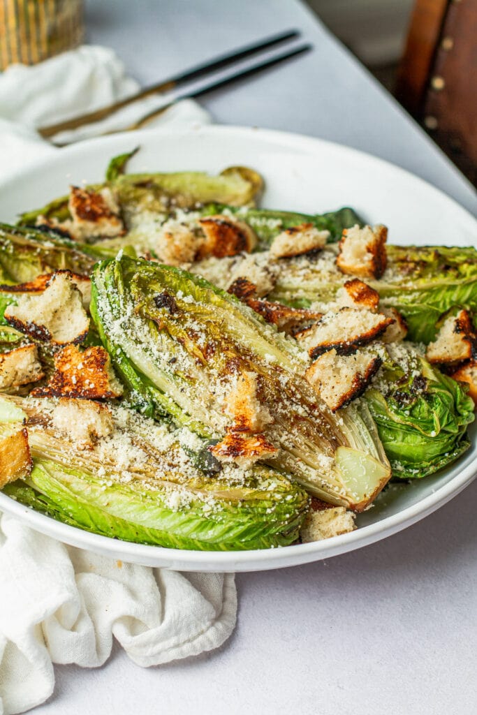 close up of the best grilled Caesar salad in a bowl
