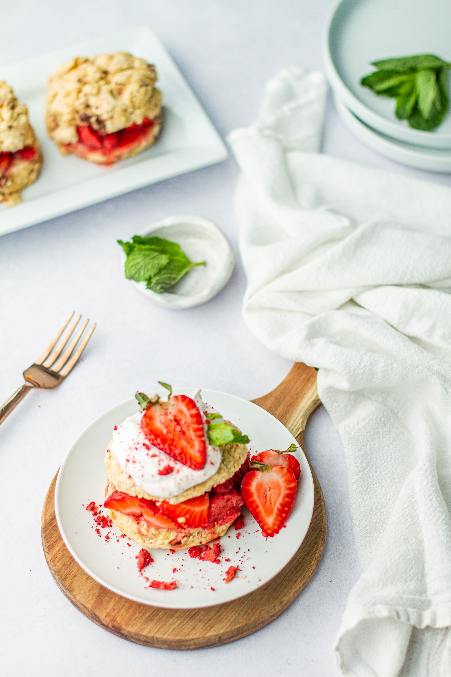 A plated portion of Very Strawberry Shortcake on a white table