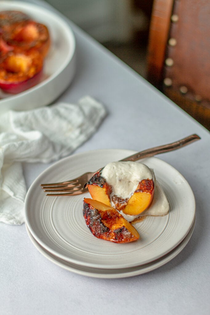 Brown Sugar Grilled Peaches on plate with a fork