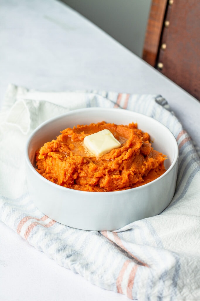 whipped sweet potatoes with a pat of butter