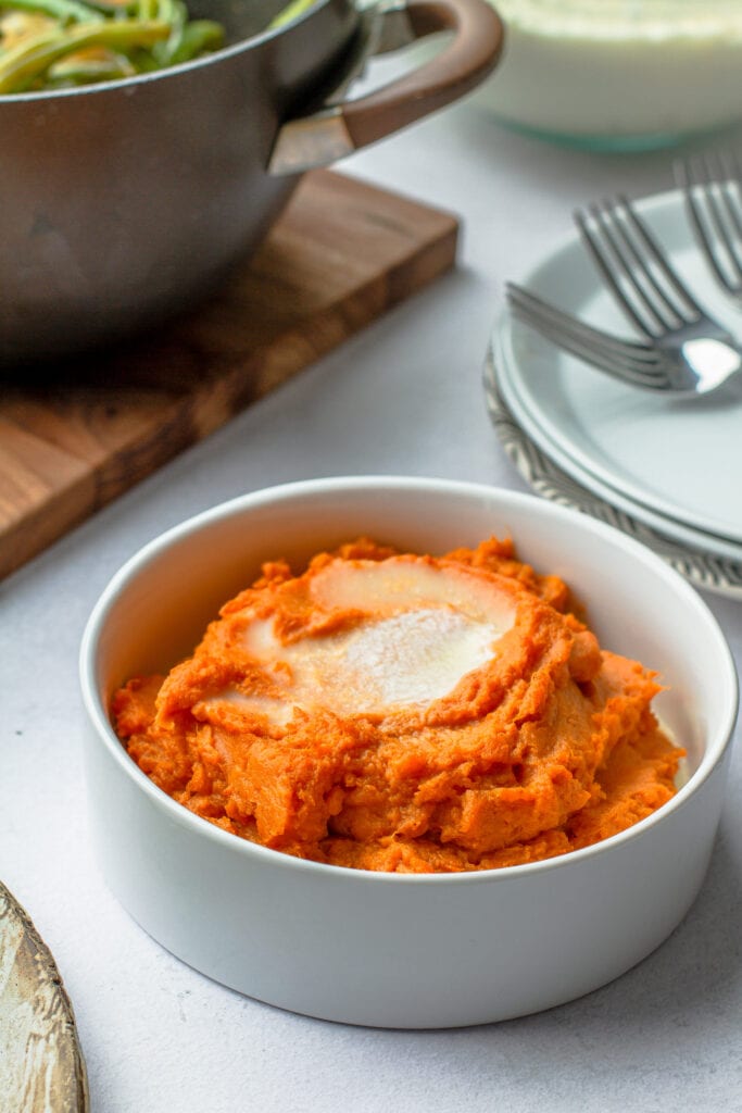 sweet potato puree in a bowl with melted butter