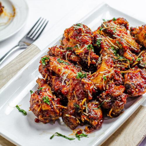 a platter of sun-dried tomato sticky wings