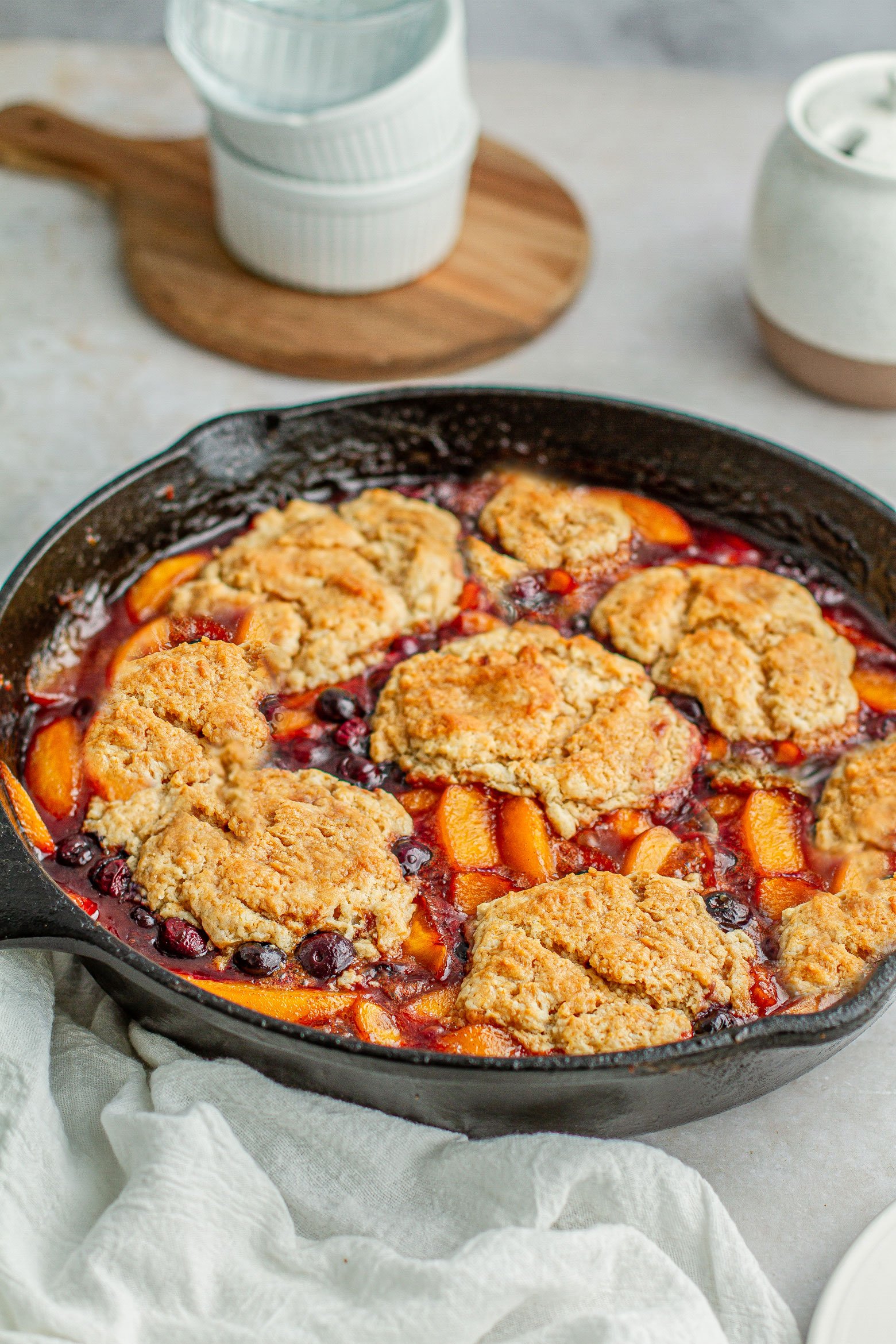 Cast iron skillet peach cobbler. In 12 inch cast iron skillet melt